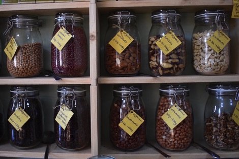 Jars of nuts and pulses on shelves